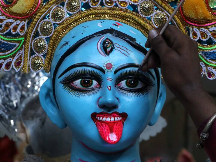 An artisan paints the eye on an idol of Goddess Chandi ahead of Durga Puja. According to Hindu mythology, Lord Ram prayed to Goddess Durga for success before the war against Ravan in Lanka. Pleased with his devotion, the Mother Goddess appeared before him in her Chandi form and blessed him. (Image Source: PTI)