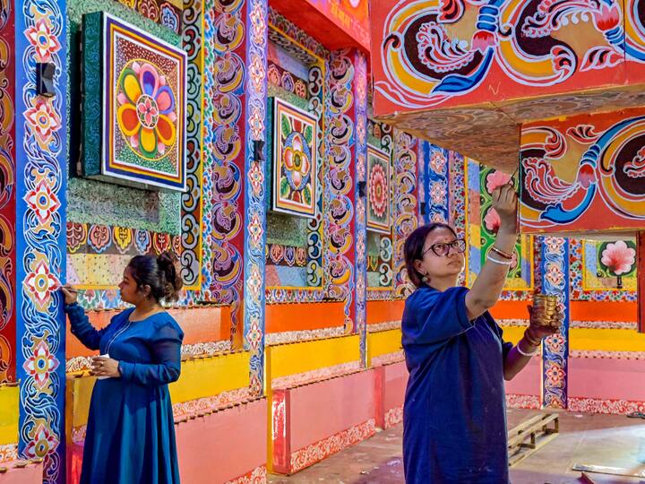 Artisans apply finishing touches to a pandal ahead of Durga Puja in West Bengal's Nadia. The festival will end with Vijaya Dashami on October 24. (Image Source: PTI)