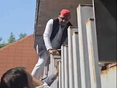 Akhilesh Yadav Scales Jai Prakash Narayan International Centre Gate After Being Denied Entry In Lucknow. WATCH