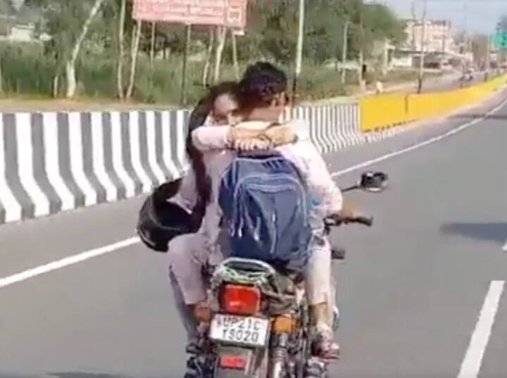 Hapur police issued 8000 rs challan to husband wife for hugging while bike riding Hapur: चलती बाइक पर फिल्मी स्टाइल में रोमांस करना पति-पत्नी को पड़ा भारी, वीडियो वायरल होने पर कटा 8 हजार चालान