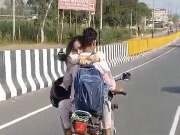 UP Couple Hug While Riding Bike Get Fined Hapur Police Fine Couple Hugging On Bike Video Viral UP Couple Hug While Riding Bike, Get Slapped With Rs 8,000 Fine