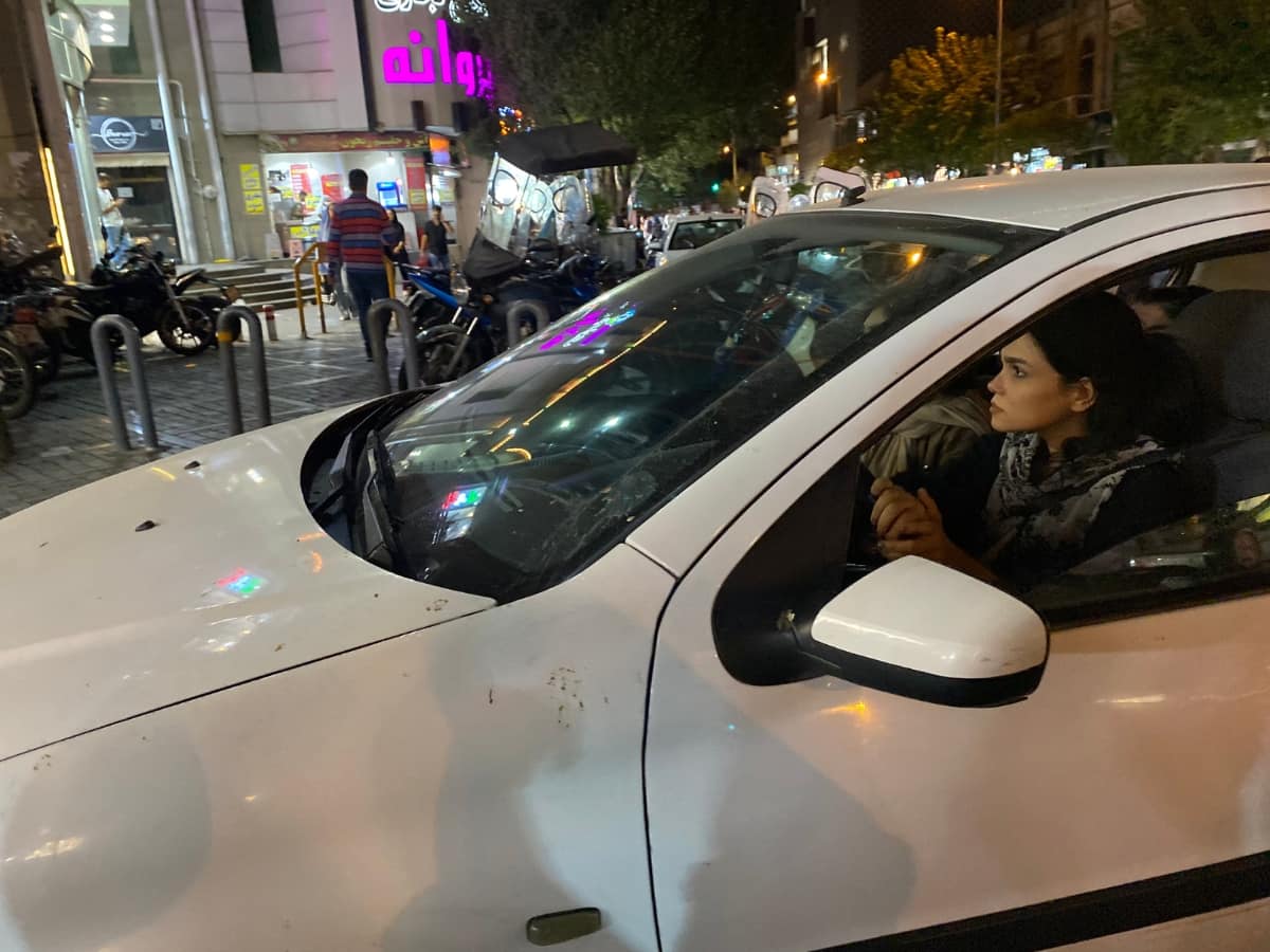 A woman drives a car in Tehran | Photo: Nayanima Basu
