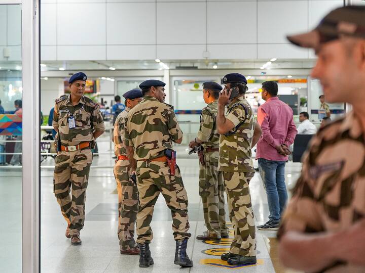 Security personnel stand guard as the loved ones of the Indians in Israel wait for the arrival of Indian nationals evacuated from Tel Aviv under Operation Ajay, at Terminal-3 of Indira Gandhi International Airport. (Image Source: PTI)