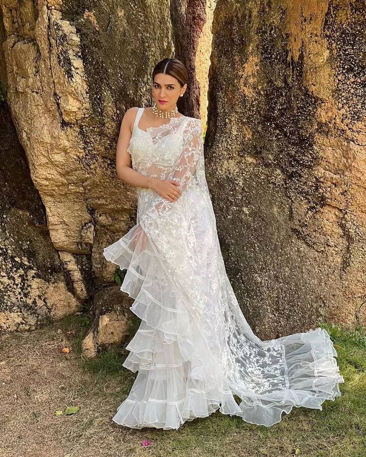 Kriti Sanon draped herself in a white net ruffle drape that exuded ethereal beauty. Her choice of attire resonated with grace and poise, making her a style icon to watch out for. (Image Source: PR Handout)