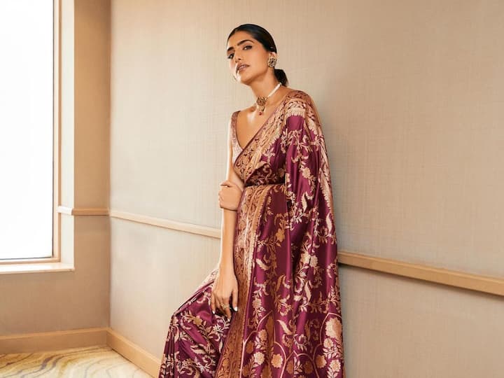 Kubbra Sait treated fans with pictures in a maroon saree for a new photoshoot. Kubbra looked elegant in traditional wear