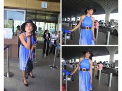 Shriya Saran Aces Airport Fashion In A Blue Halter Neck Dress