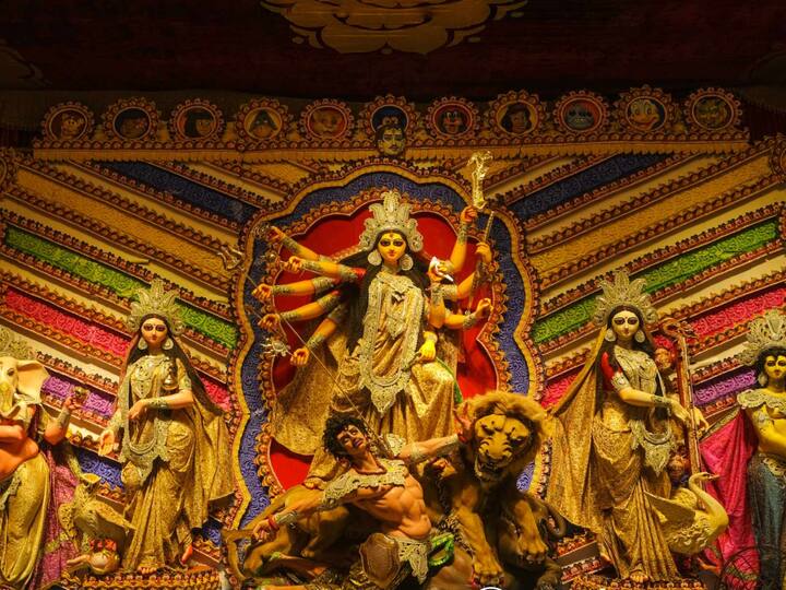 The golden-saree clad Goddess stands with all her power as she graces the Disneyland-themed pandal of Shreebhumi Club. (Image Source: Facebook/ Pritam Dutta)