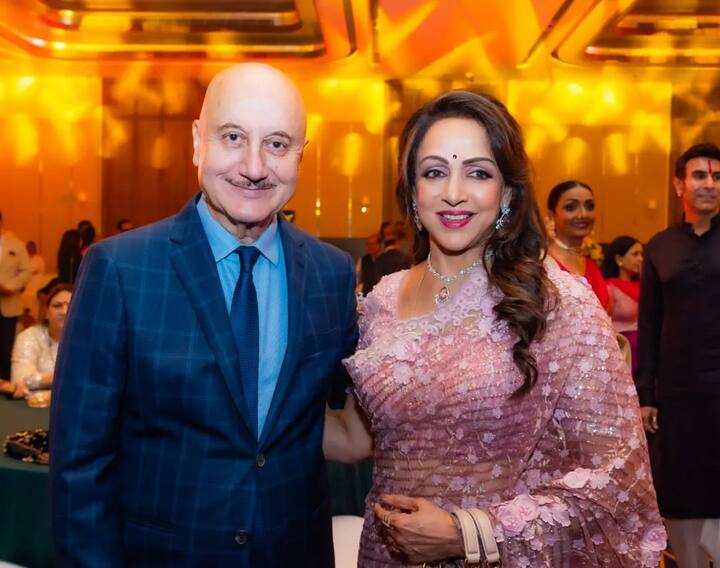 Hema Malini and Anupam Kher pose for the photographs.