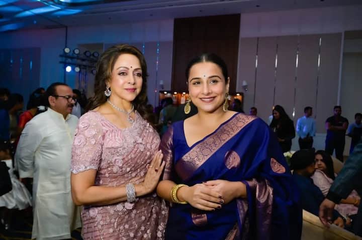 Vidya Balan, who also attended the birthday bash, poses with Hema Malini.