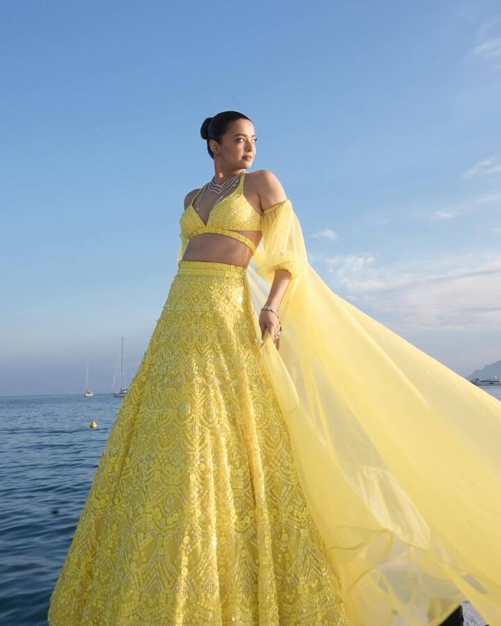 Surveen Chawla oozed elegance and charm in a beautiful lehenga as she posed by the sea.  (Image Source: PR Handout)