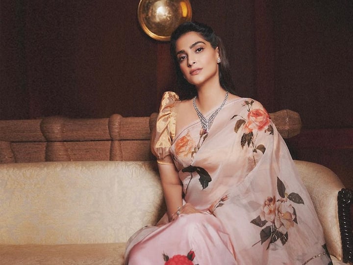 Sonam Kapoor shows off a gorgeous look in an organza saree covered with flower artwork.