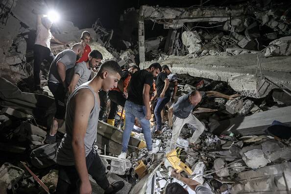 Israel bombarded Gaza early Friday, hitting areas in the south where Palestinians had been told to seek safety, and it began evacuating a sizable Israeli town in the north near the Lebanese border. (Photo: Getty)