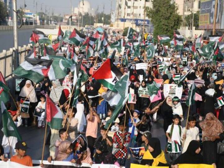 Supporters of Palestine Foundation, carrying Palestinian flags and banners, take part in a rally against Israeli airstrikes on Gaza and to show solidarity with Palestinian people in Pakistan's Karachi. (Image Credit: Getty Images)