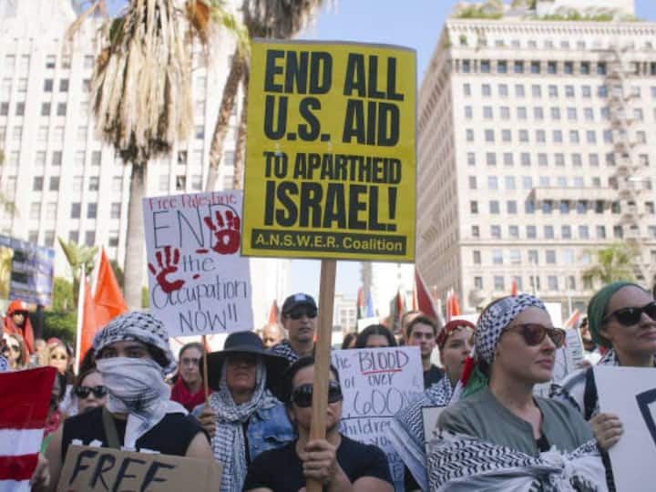 People take part in a demonstration to show their solidarity with Palestinian people in Los Angeles, California, United States on October 21, 2023. (Image Credit: Getty Images)