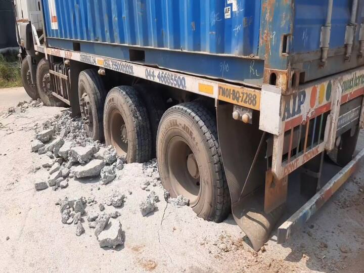 Damage to the cement road constructed by the Rural Development (D) Panchayat Department in Kilikadirpur Panchayat under Kanchipuram Panchayat Union TNN ஒரு வருடத்திற்கு முன் அமைக்கப்பட்ட சாலை... பள்ளத்தில் சிக்கிய கன்டெய்னர் லாரி