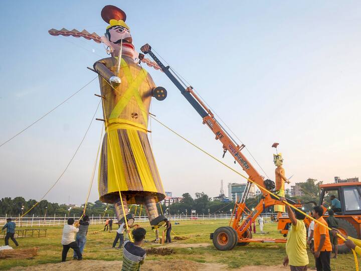 An effigy of demon king Ravana being installed on the eve of Dussehra celebrations, at Gandhi Maidan in Patna. Image Source: PTI
