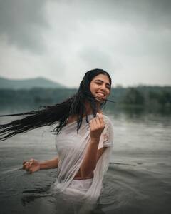 Malavika Mohanan Raises Temperature In White Saree & Water Photoshoot; See Pics