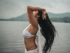 Malavika Mohanan Raises Temperature In White Saree & Water Photoshoot; See Pics