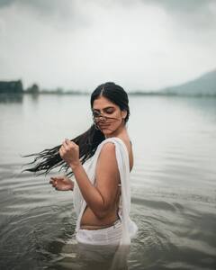 Malavika Mohanan Raises Temperature In White Saree & Water Photoshoot; See Pics