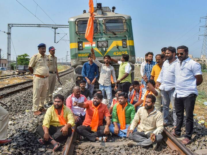 Maratha Kranti Morcha activists stop a train at a railway station during a protest to press for Maratha reservation in Solapur. (Image Credit: PTI)