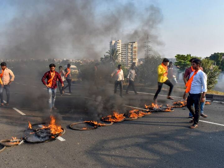 Maratha Kranti Morcha activists burn tyres and other inflamable items during a protest on Pune-Solapur Highway to press for Maratha reservation in Solapur on Tuesday, Oct 31. (Image Credit: PTI)