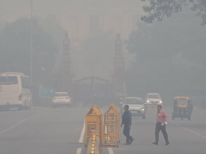 Commuters on a road amid hazy weather conditions, in New Delhi. Delhi's Air Quality Index (AQI) stood in the 