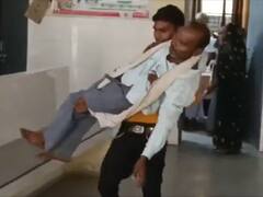 अस्पताल में स्ट्रेचर नहीं मिलने पर पिता को गोद में उठाकर ले गया युवक, कांग्रेस ने सरकार पर साधा निशाना