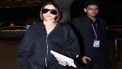 બ્લેક ઓવરસાઇઝ આઉટફિટ પહેરી એરપોર્ટ પર સ્પોર્ટ થઇ Malaika Arora