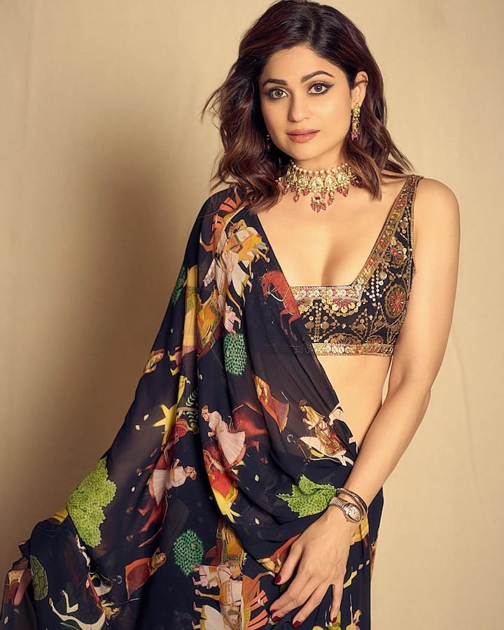 The diva accessorised with statement jewellery and a luxury designer watch.