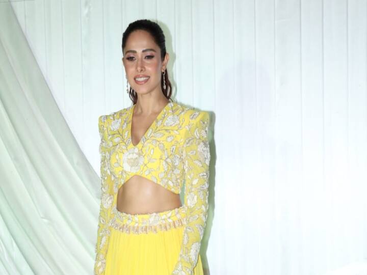 Nushrratt Bharuccha looks gorgeous as she shows off her yellow outfit at a Diwali party.