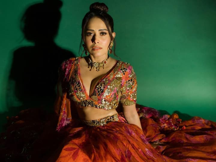 Nushrratt Bharuccha treated fans with pictures in a printed orange and pink lehenga looking the most stunning