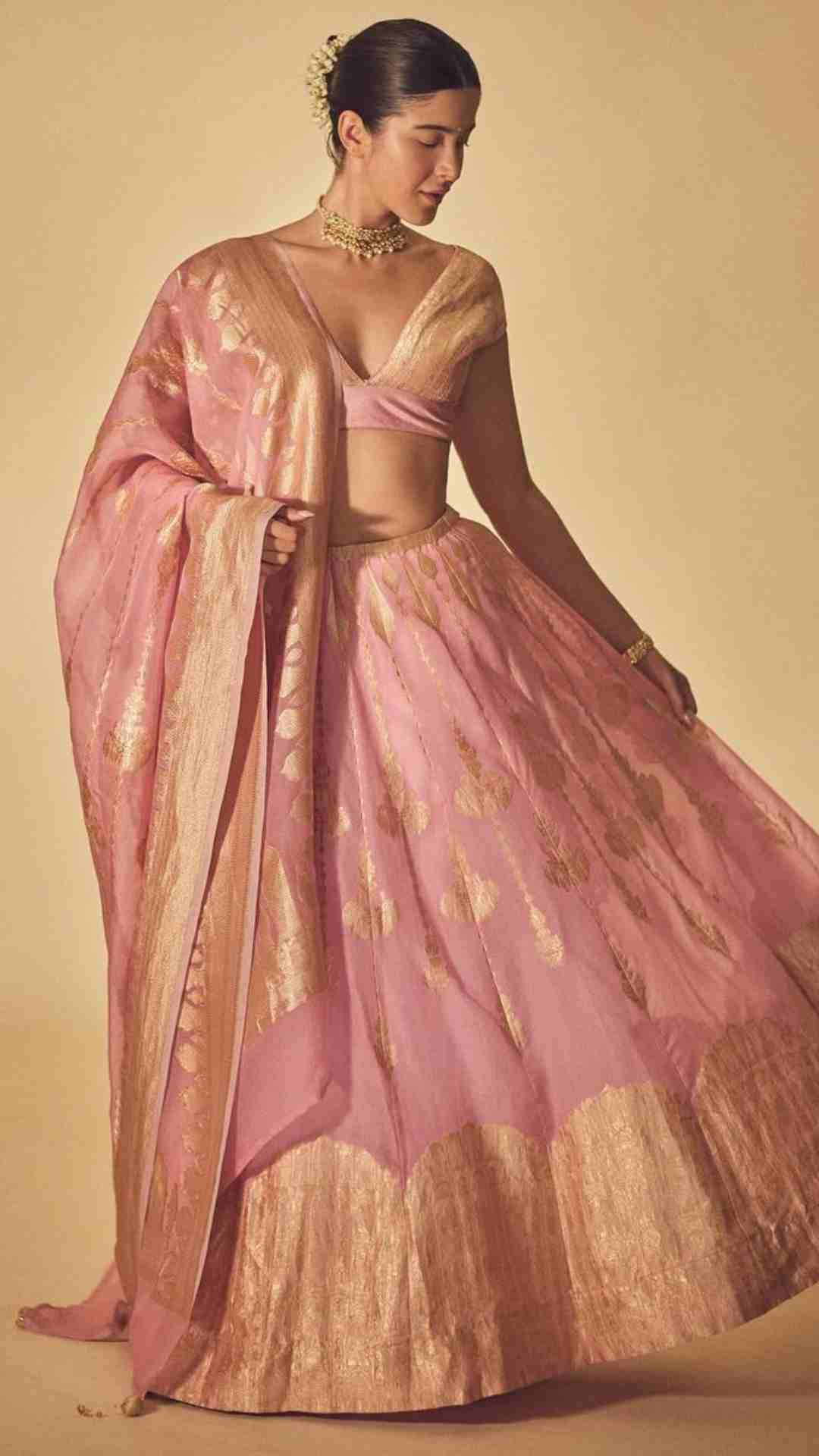 Photo of Gold bridal jewellery with light pink lehenga