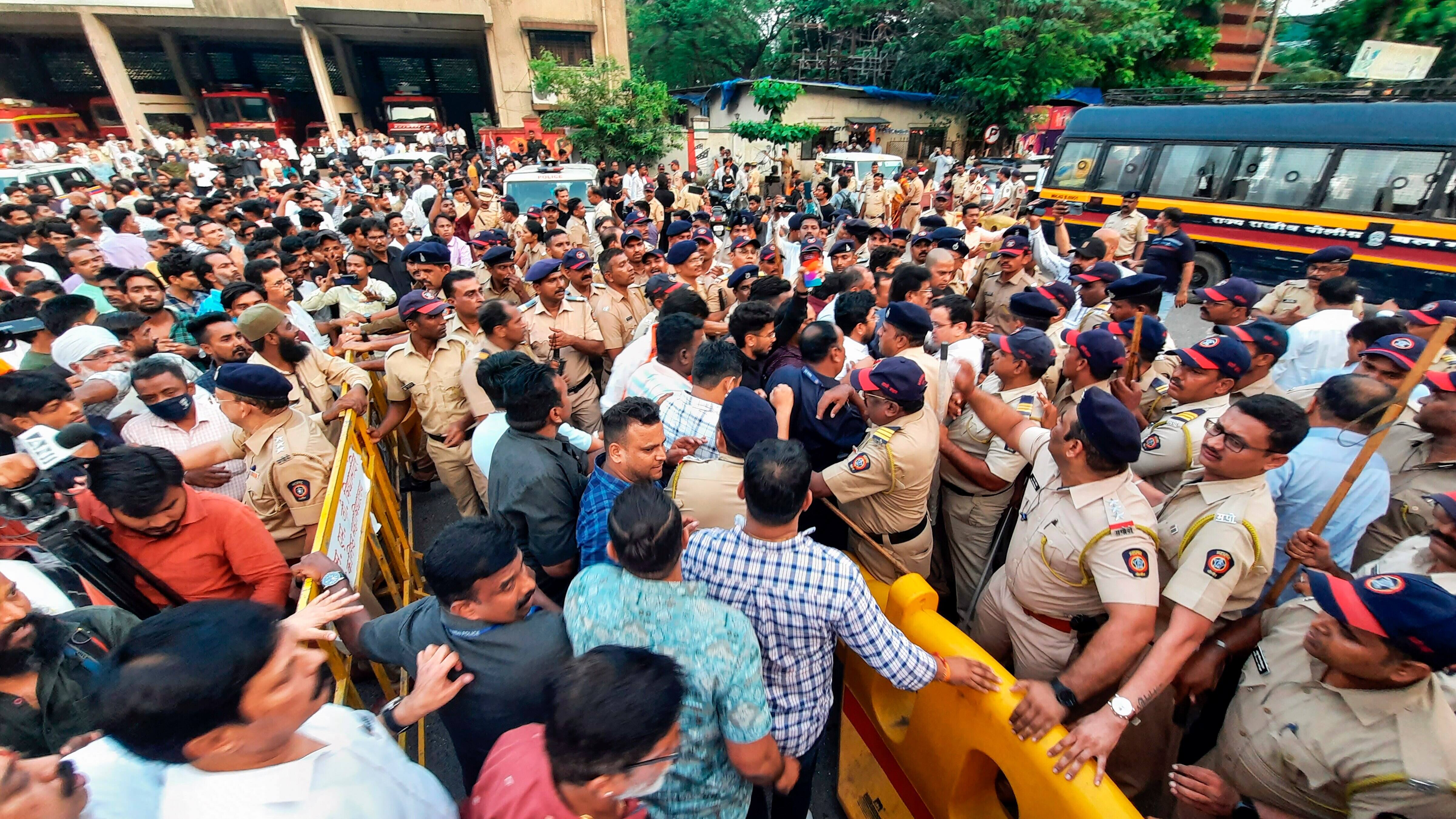 Police personnel and Shiv Sena (UBT) supporters in scuffle when their chief Uddhav Thackeray on his way from Mumbai to inspect the damaged party's office, in Thane, Saturday, Nov. 11, 2023. (PTI Photo)