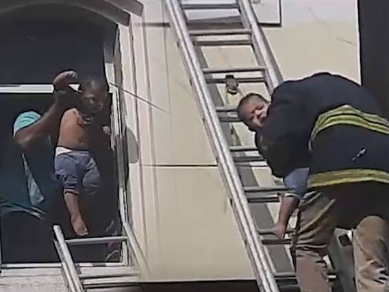 పొగల్లో పిల్లాడు.. స్థానికుల సాయంతో చాకచక్యంగా రక్షించిన ఫైర్ సిబ్బంది