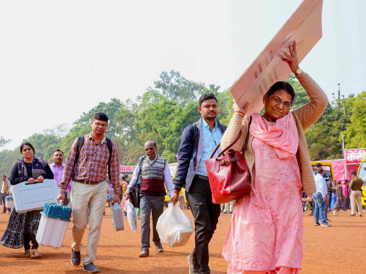 Polling officials carrying election materials and EVMs ahead of Madhya Pradesh Assembly elections, in Bhopal. (Source: PTI)