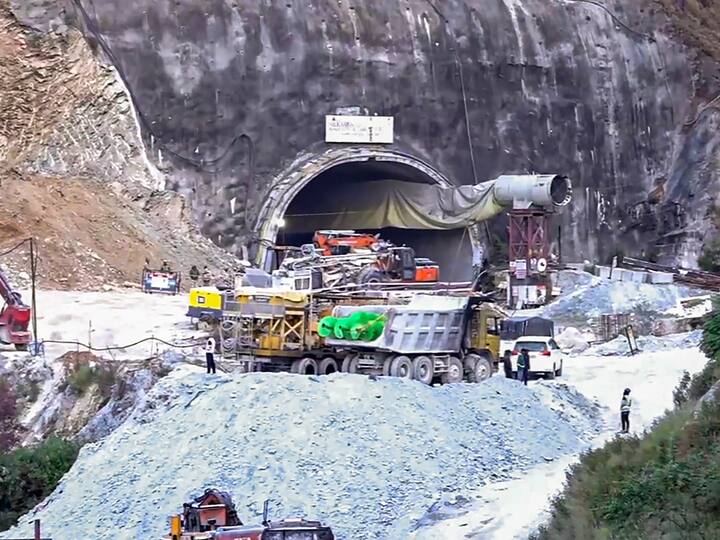 As rescue work for the trapped workers continues, debris being brought out from the under-construction tunnel between Silkyara and Dandalgaon, in Uttarkashi district on Thursday. (Source: PTI)
