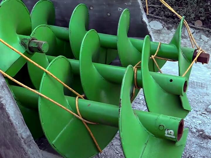 The drilling machine flown in from Delhi being operated to speed up the process. (Source: PTI)