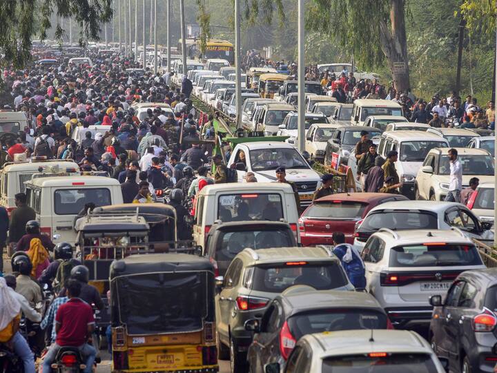 Vehicles stuck in a traffic jam outside a distribution centre of EVMs ahead of Madhya Pradesh Assembly elections, in Jabalpur on Thursday. (Source: PTI)