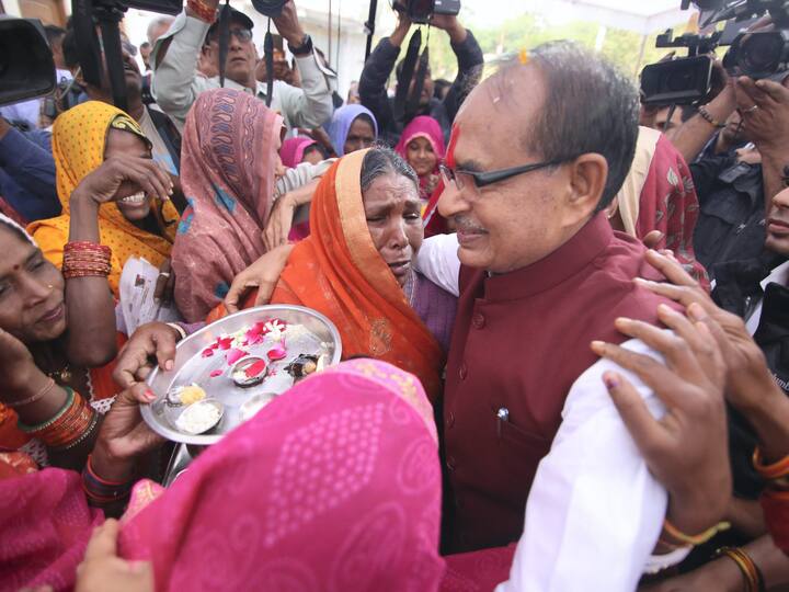 Madhya Pradesh Chief Minister Shivraj Singh Chouhan meets voters in Sehore district during elections in his state. (Source: PTI)