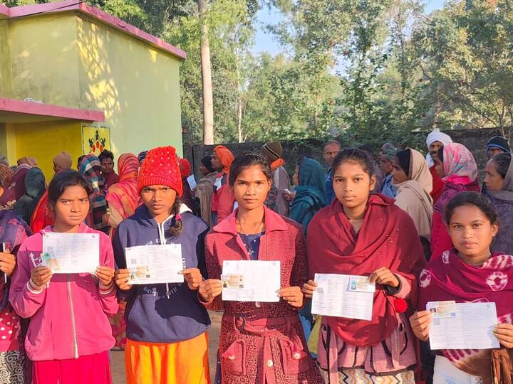 Young women pose with their Voter's ID cards before casting their ballot in Sarguja district during the Chhattisgarh Phase-II elections. (Source: X/@ECISVEEP)