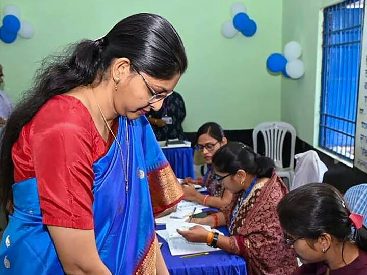 Chhattisgarh Chief Electoral Officer Reena Baba Saheb Kangale gets her finger marked with indelible ink after casting her vote during the second phase of the state assembly elections at a polling station in Raipur district. (Source: PTI)