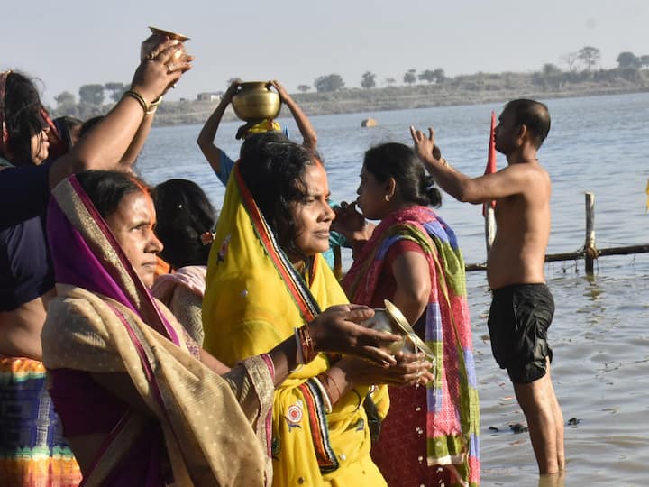 Devotees offer prayers to the rising sun on the banks of the Ganga river. (Image Source: PTI)