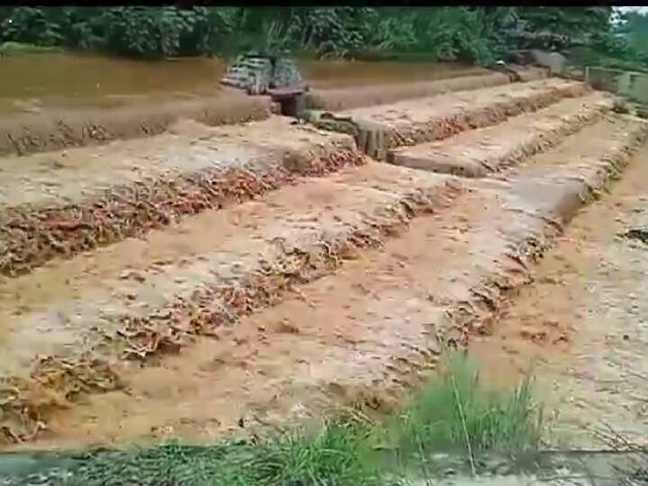 புட்டுவிக்கி அணையில் இருந்து வெளியேறும் வெள்ள நீர்