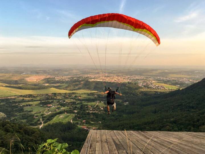 Paragliding beckons enthusiasts to explore the heights at select hill stations. For those seeking the ultimate paragliding experience, here's a curated list of destinations worth considering.