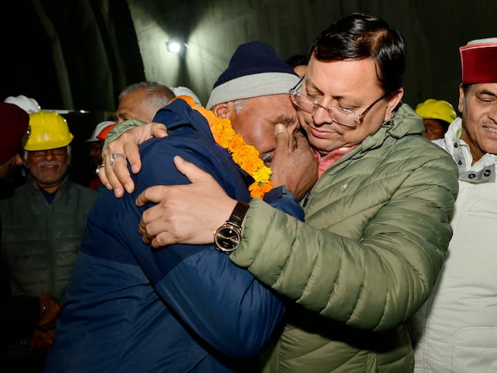 Uttarakhand Chief Minister Pushkar Singh Dhami greeted a rescued worker after a successful evacuation at the under-construction Silkyara Bend-Barkot Tunnel. (Image Source: PTI)