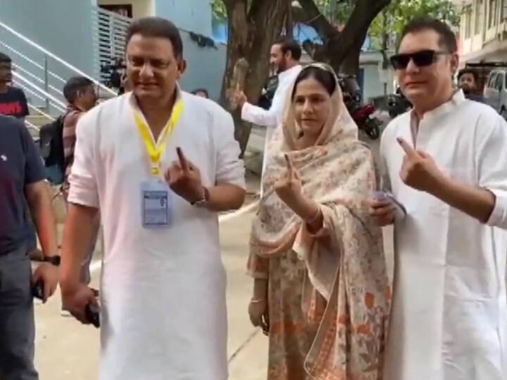 Former cricketer and Congress Jubilee Hills MLA candidate Mohammad Azharuddin takes a photo showing his inked finger after casting his vote in Hyderabad. (Source: ANI)