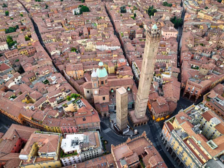 Garisenda Leaning Tower Italy Bologna Built In 12th Century Risk Of Collapse Barrier Surround Contain Debris Bologna's Leaning Tower Faces Collapse Risk, 5-Metre High Barrier Erected To Contain Debris