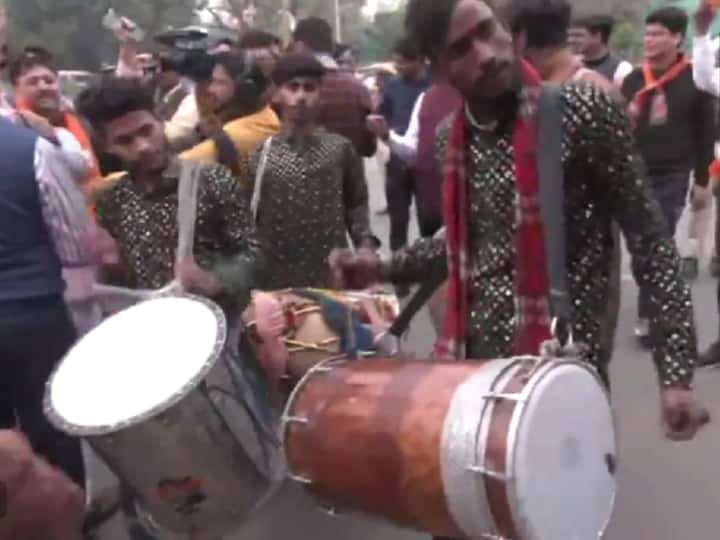 Beating of drums and dancing by BJP workers outside the party office in Jaipur. (Source: ANI)