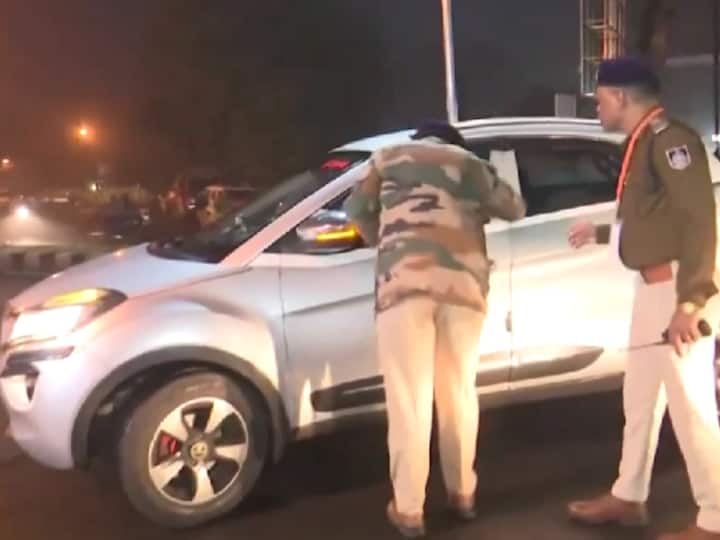 Policemen conduct security checks of a car arriving at a counting centre in Bhopal, Madhya Pradesh. (Source: ANI)