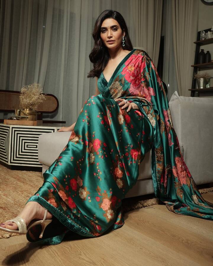 The beautiful floral print adds a touch of grace, making her ensemble a perfect blend of traditional charm and modern elegance. (Image: Instagram/@karishmaktanna)